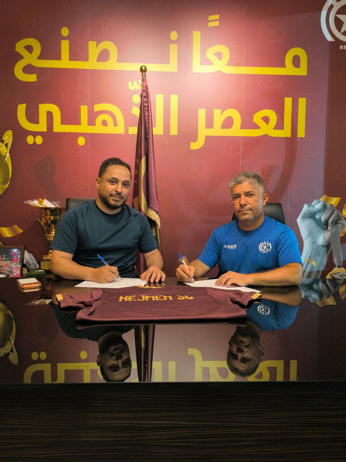 Signing the partnership at the club