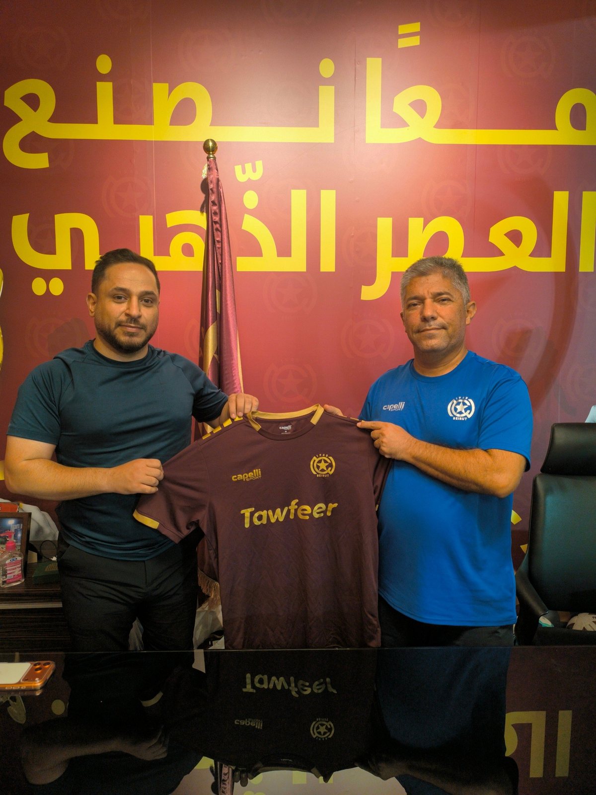 Signing the partnership at the club